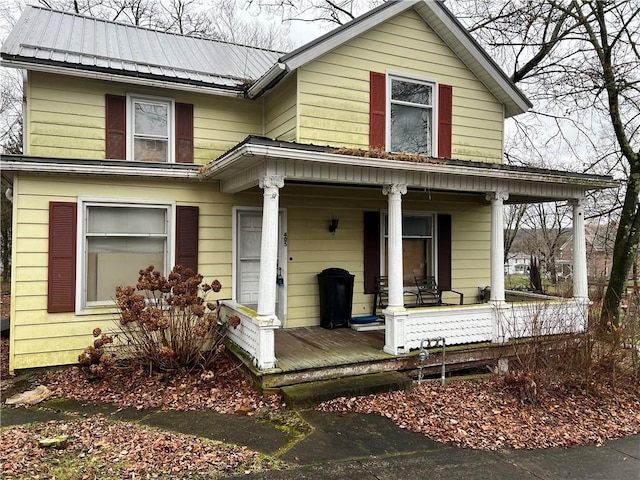 farmhouse featuring covered porch