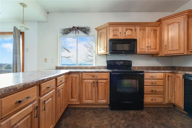 kitchen with black appliances and decorative light fixtures