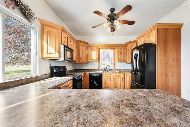 kitchen featuring black appliances, ceiling fan, lofted ceiling, and sink