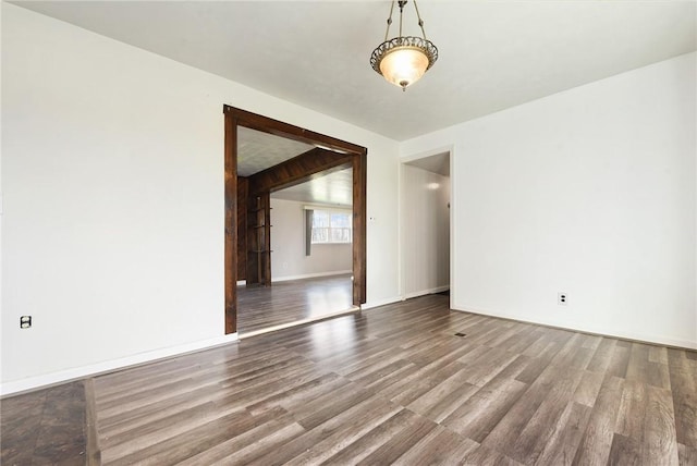 empty room with hardwood / wood-style flooring