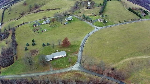 birds eye view of property with a rural view