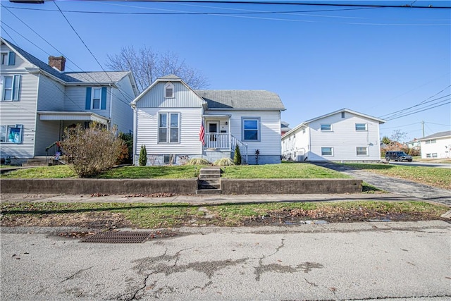 bungalow-style house with a front lawn