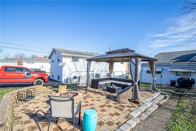 view of patio with a gazebo, area for grilling, and a fire pit