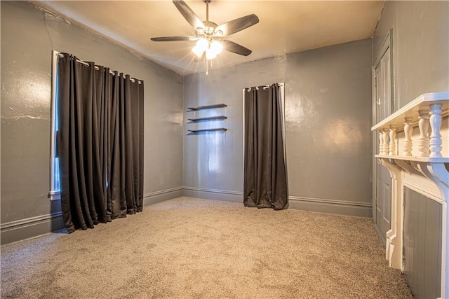 carpeted empty room with ceiling fan