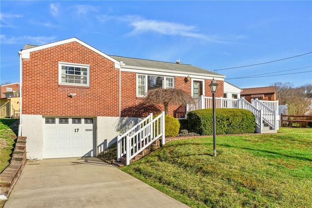 view of front of property with a garage and a front lawn