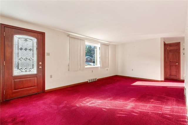 entrance foyer with carpet flooring