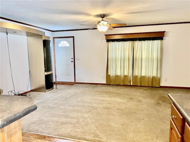 interior space featuring ceiling fan and ornamental molding