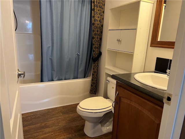 full bathroom featuring vanity, toilet, wood-type flooring, and shower / tub combo