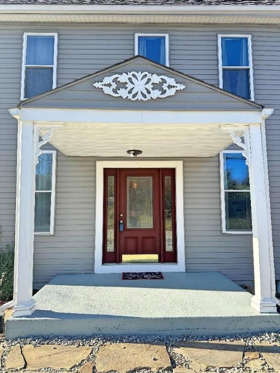 doorway to property with covered porch