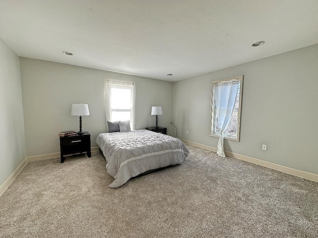 bedroom with light carpet