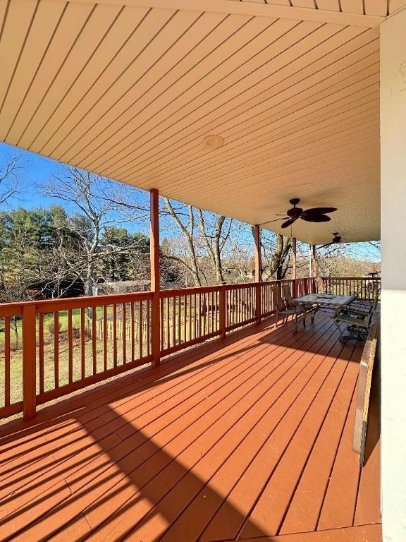 wooden deck with ceiling fan