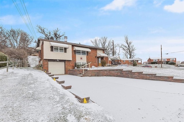 raised ranch featuring a garage