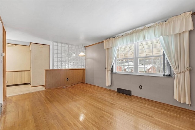 unfurnished room with light hardwood / wood-style flooring