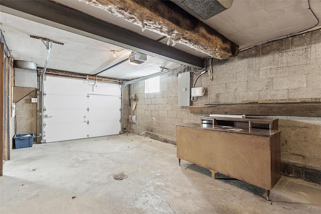 garage featuring electric panel and a garage door opener