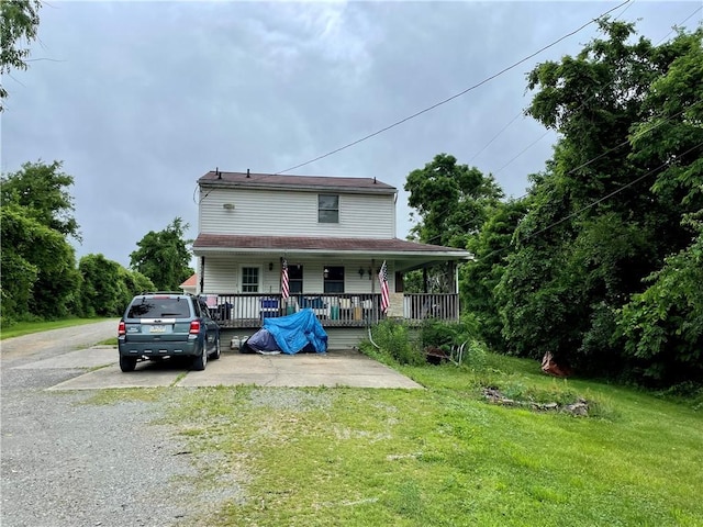 view of front of home featuring a porch and a front lawn