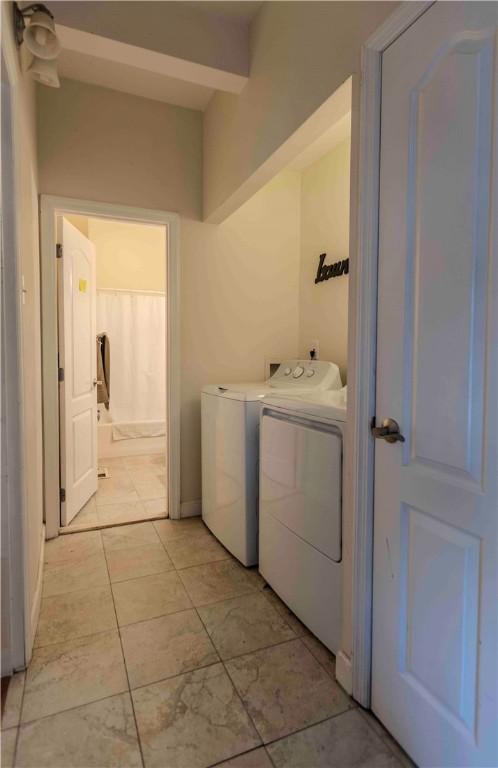 clothes washing area with independent washer and dryer