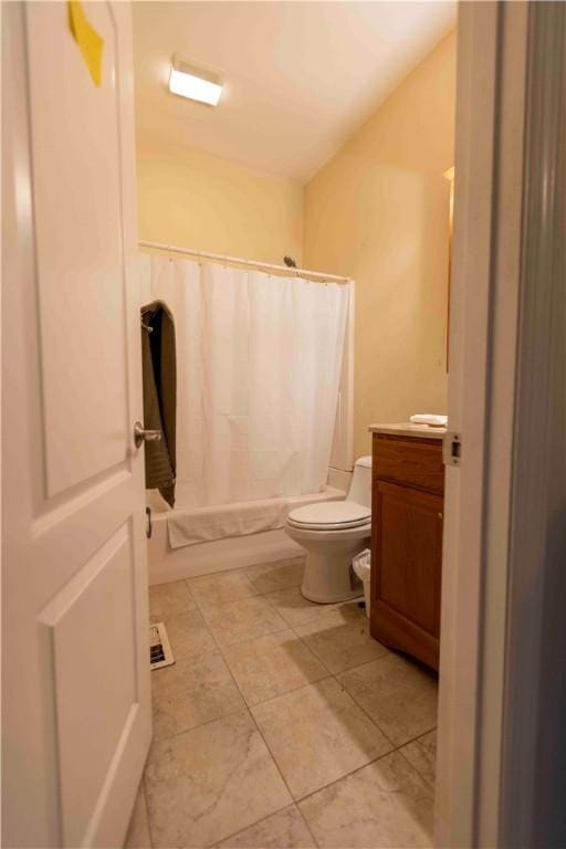 full bathroom featuring shower / bath combination with curtain, vanity, and toilet