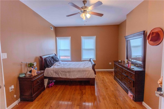 bedroom featuring light hardwood / wood-style floors and ceiling fan