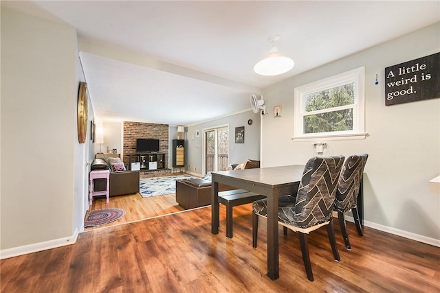 dining space featuring wood-type flooring