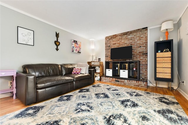 living room featuring wood-type flooring and ornamental molding