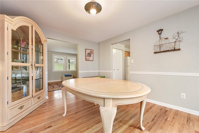 dining room with light wood-type flooring