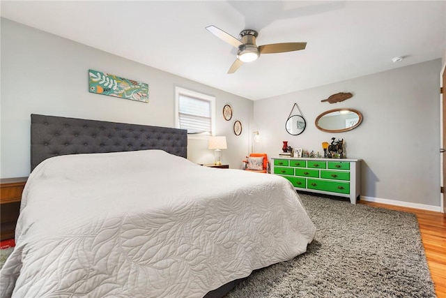 bedroom featuring hardwood / wood-style flooring and ceiling fan