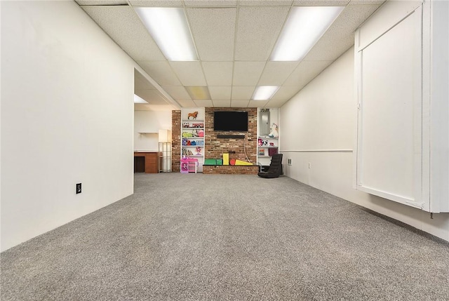 basement with carpet flooring and a drop ceiling