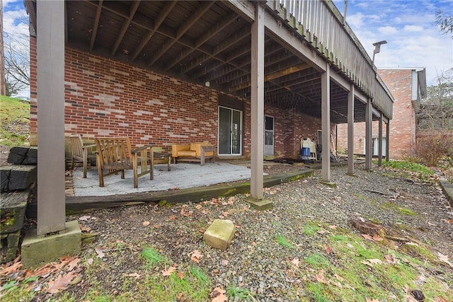 view of side of property with a patio