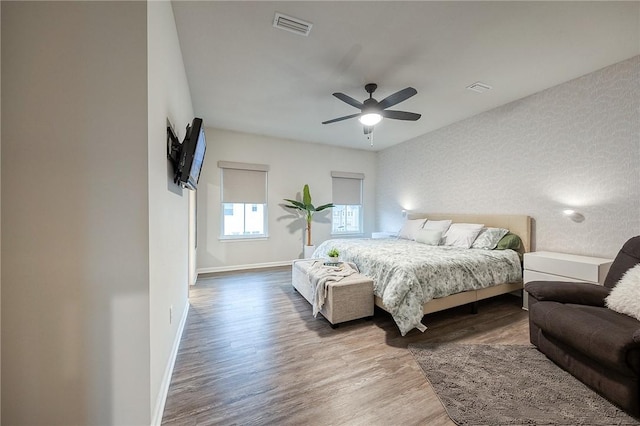 bedroom with wood-type flooring and ceiling fan