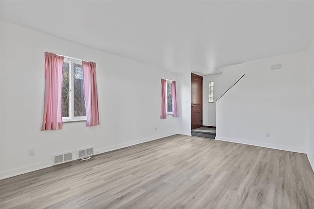 unfurnished room with light hardwood / wood-style flooring