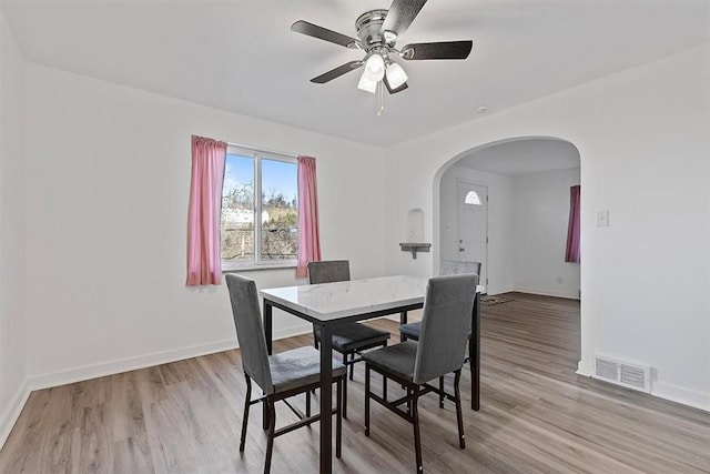 dining space featuring light hardwood / wood-style flooring and ceiling fan