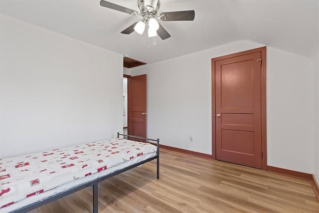 bedroom with ceiling fan and light hardwood / wood-style flooring