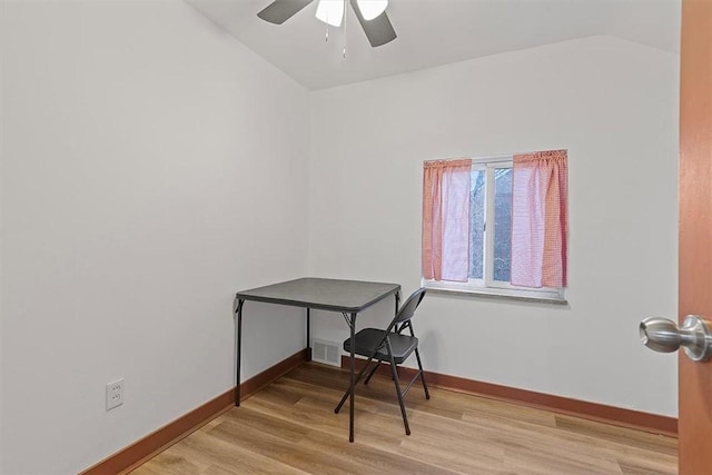 office with light wood-type flooring, ceiling fan, and lofted ceiling