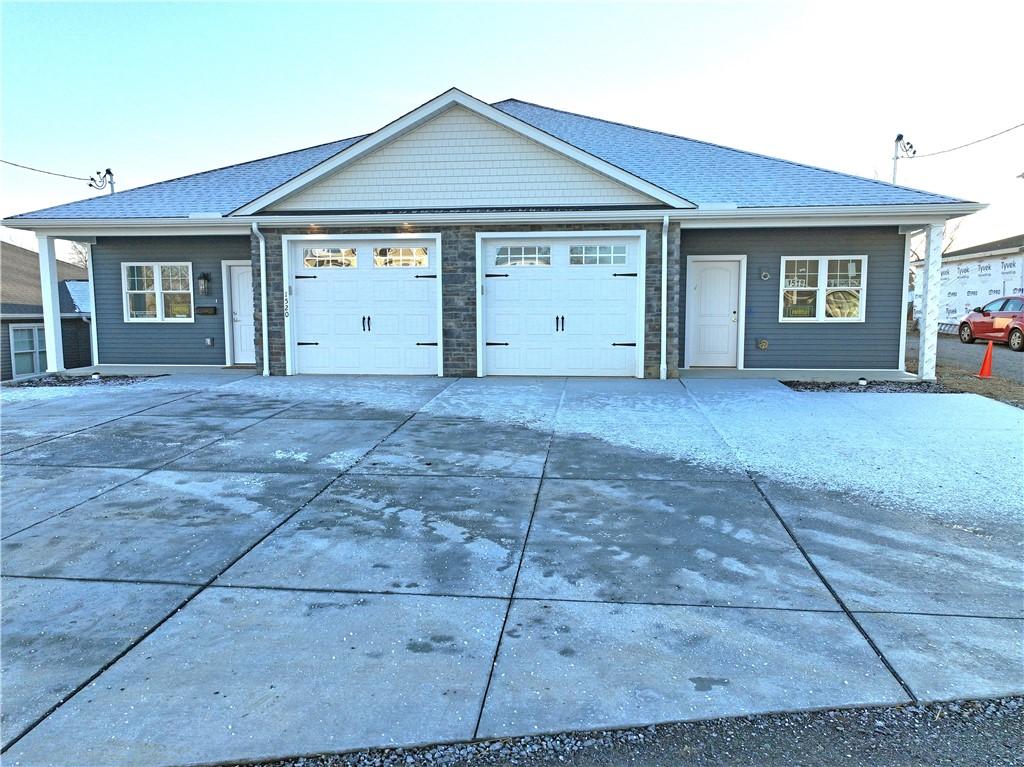 single story home featuring a garage