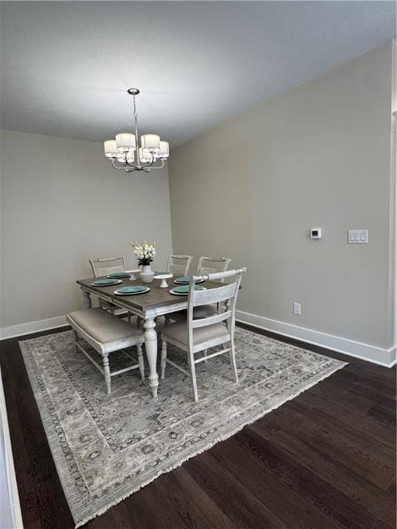 1518 Marshall Rd, Monaca, PA 15061 - dining area with dark wood-style floors, baseboards, and a chandelier
