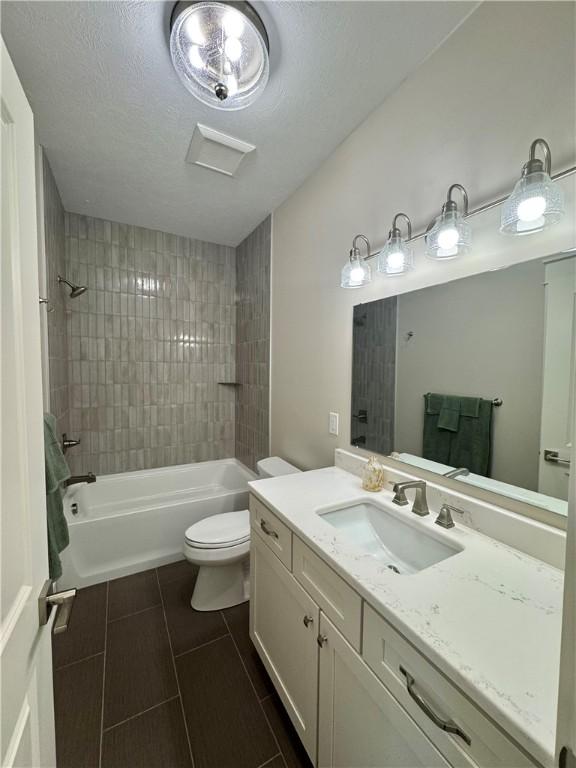 1518 Marshall Rd, Monaca, PA 15061 - bathroom featuring vanity, toilet, tile patterned floors, and tub / shower combination