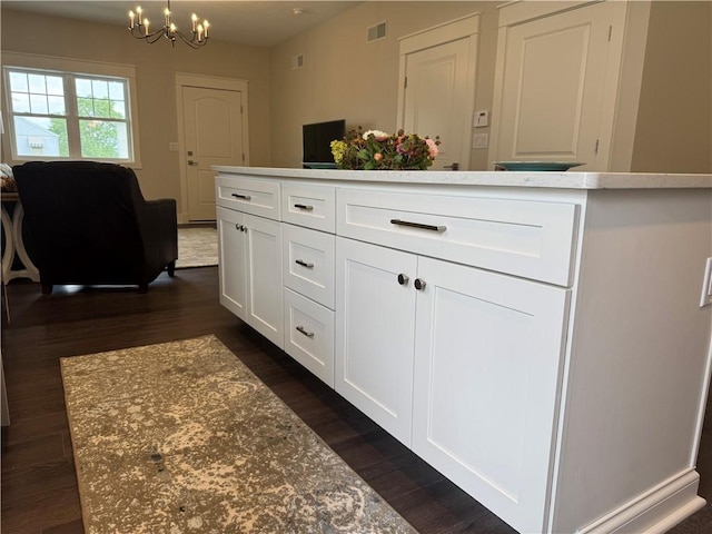 1518 Marshall Rd, Monaca, PA 15061 - kitchen featuring dark wood-style flooring, a chandelier, white cabinetry, and open floor plan