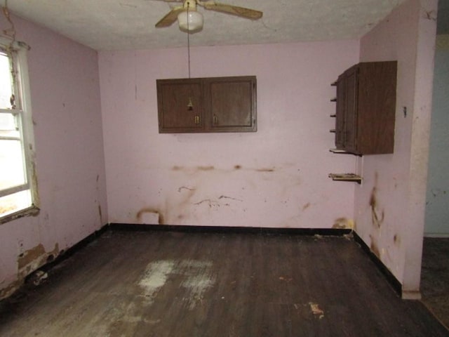 spare room featuring ceiling fan and dark hardwood / wood-style flooring