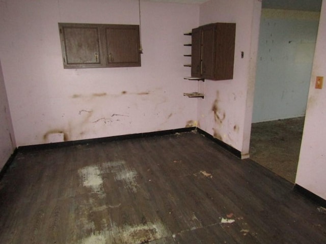 unfurnished room featuring dark hardwood / wood-style floors