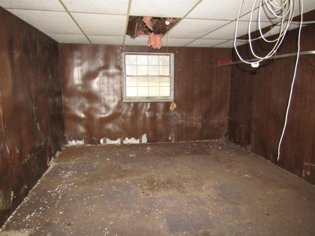 basement featuring a drop ceiling