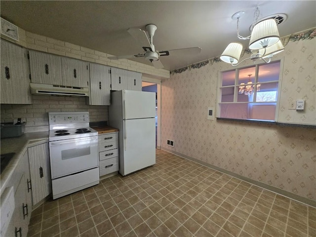 kitchen with ceiling fan with notable chandelier, white appliances, ventilation hood, decorative light fixtures, and white cabinetry