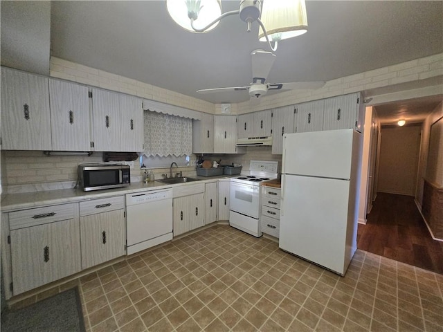 kitchen featuring white appliances, ceiling fan, sink, white cabinets, and light hardwood / wood-style floors