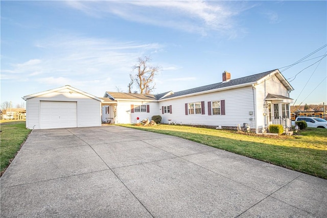 ranch-style house featuring a garage, an outbuilding, and a front yard