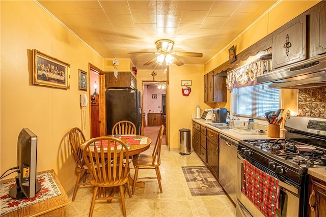 kitchen with dark brown cabinets, stainless steel appliances, crown molding, and range hood