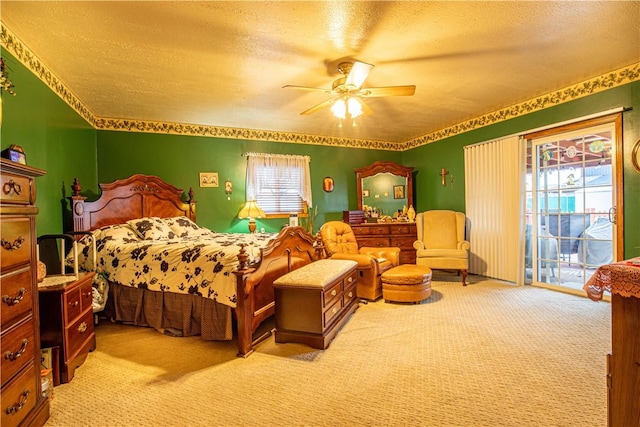 carpeted bedroom with ceiling fan, access to exterior, and a textured ceiling