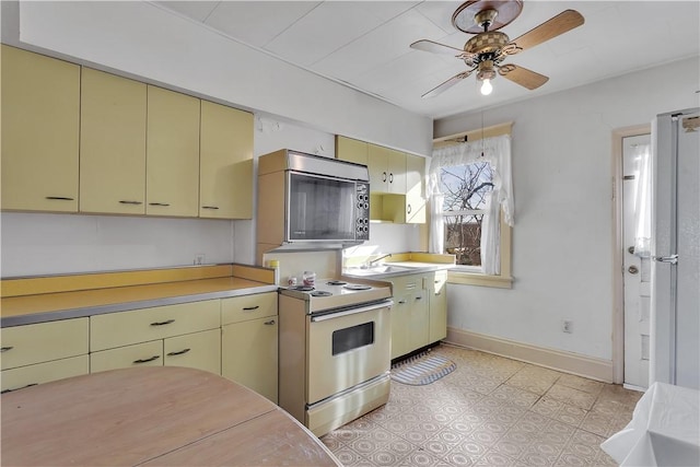 kitchen featuring ceiling fan and appliances with stainless steel finishes