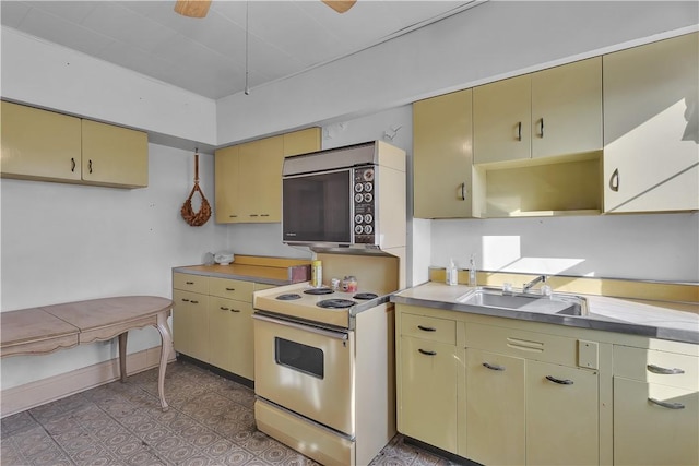 kitchen featuring light tile patterned floors, ceiling fan, and electric stove