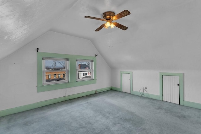 bonus room with ceiling fan, carpet floors, and lofted ceiling