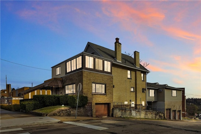 property exterior at dusk with a garage