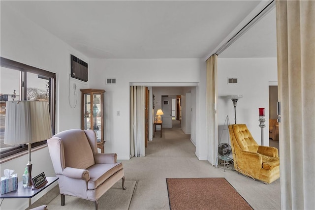 living area with light colored carpet